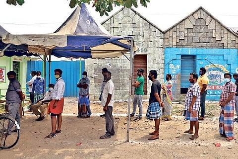People wait in queue to get vaccinated in Koyambedu
