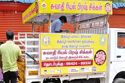 A goods carrier vehicle sells broiler chicken in Tirupur
