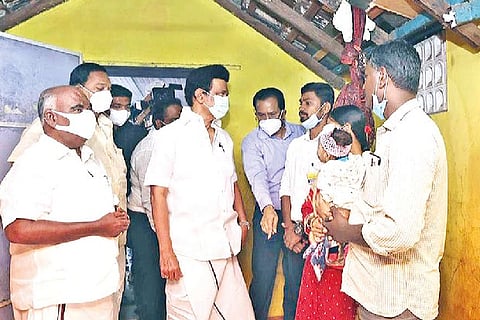 CM MK Stalin interacting with a family at the Melmonavoor Lankan camp in Vellore on Tuesday.