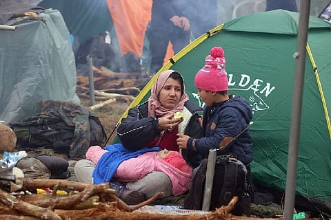 Migrants at the Polish-Belarusian border.