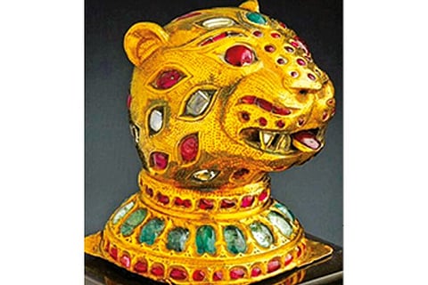 A gold jewelled tiger head
