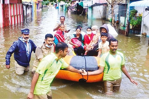Rescue personnel shifting residents of water-logged areas in rubber boats in Vellore on Friday