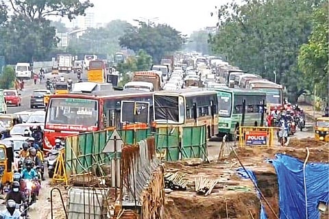 Vehicles crawl on GST Road due to ongoing works