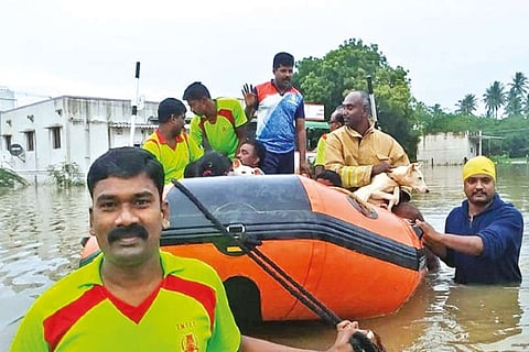 Rescued residents being ferried in a boat at Avinashipalayam in Tirupur district on Thursday