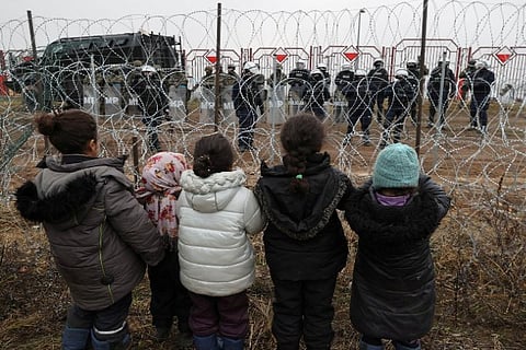 Migrants at Belarus border (Image source: Reuters)