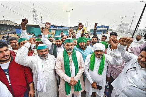 BKU leader Rakesh Tikait with farmers at Ghazipur border in New Delhi on Saturday