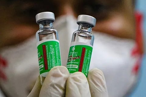 A healthcare worker carries covishield vials (File Photo)