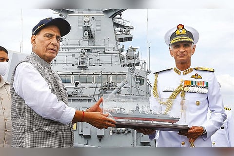 Rajnath Singh receives memento from Karambir Singh onboard INS Visakhapatnam during commissioning