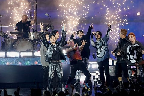 Coldplay and BTS perform during the Annual American Music Awards at Microsoft Theatre in Los Angeles
