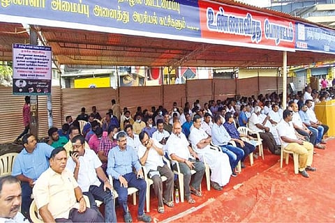 Members of knitwear industry observing a hunger protest in front of Tirupur Corporation office