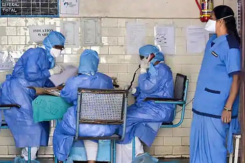 Medics outside an isolation ward of the novel COVID-19 at a hospital (Image credit: PTI)