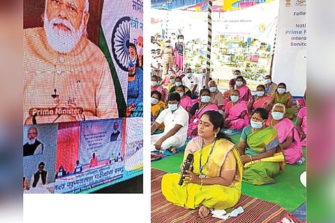The PM addresses people; women of the village (R)