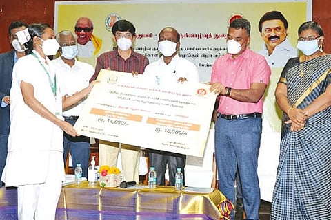 Minister Ma Subramanian making a formal launch of the increased wages for medical staff on contract.