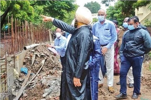 Corpn Commissioner Bedi and other officials inspecting the wall retaining work at Mambalam Canal