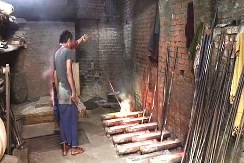 Artisans working in a Moradabad unit