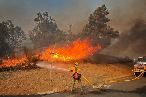 Firefighters in the process of dousing the fire. Image Courtesy: Reuters