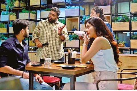 Ashwin and director Hari discussing a scene at the shooting spot of Enna Solla Pogirai