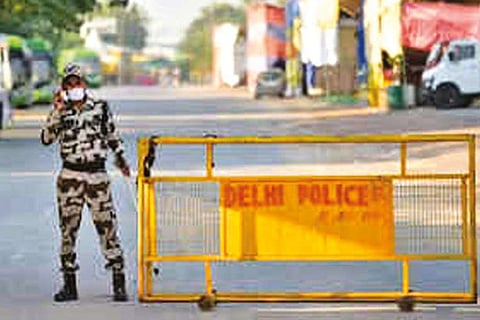 A security personnel keeps vigil at Singhu border near the site