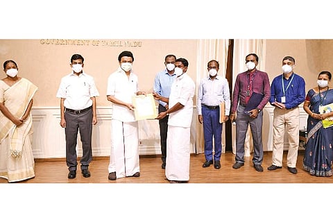 CM MK Stalin inaugurating the crop insurance scheme by distributing it to a farmer in Chennai