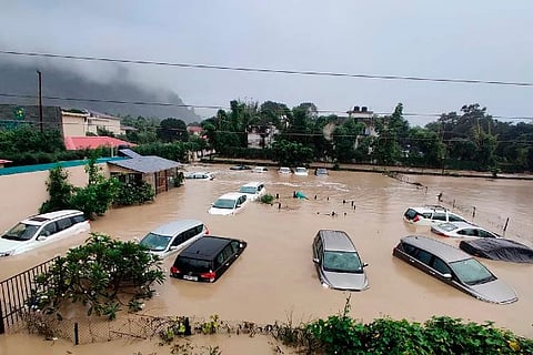 Submerged cars seen at flooded resort as extreme rainfall caused Kosi River overflow in Uttarakhand