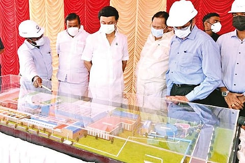 Officials explaining components of a desalination plant to CM MK Stalin in Nemmeli