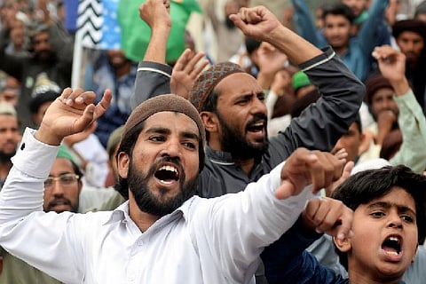 TLP workers protesting their leader Saad Rizvi's arrest. Image Courtesy: Reuters