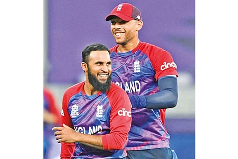 England leg-spinner Adil Rashid (left) was the wrecker-in-chief with four wickets