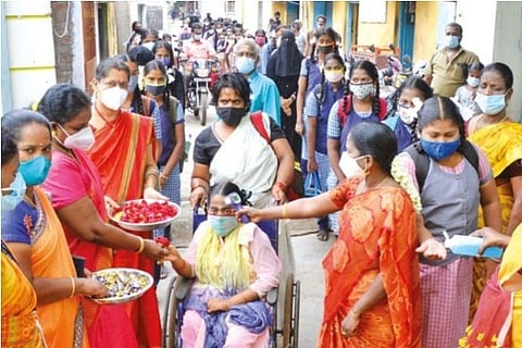 Teachers shower petals at students as schools resume