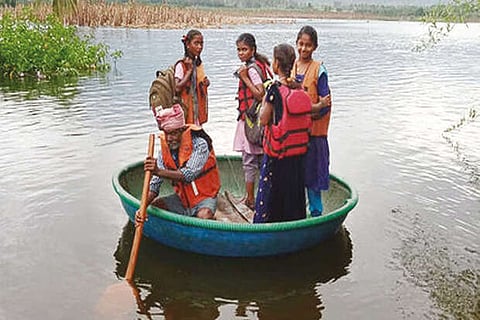 Tribal students cross river in coracles as bridge submerges