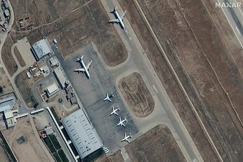 Six commercial aircraft are seen near the main terminal of Mazar-i-Sharif airport