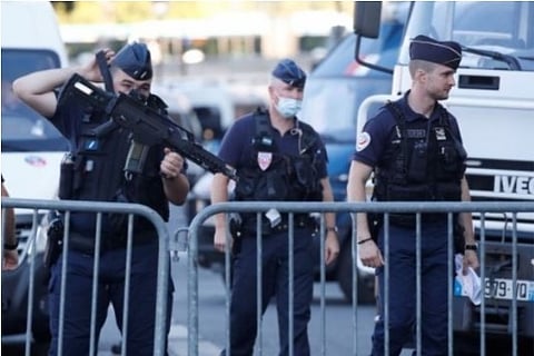 French Police forces guard near the Paris courthouse (Credit: Reuters)