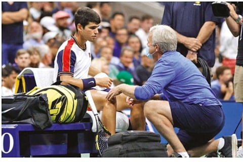 File Photo : Carlos Alcaraz receives medical attention
