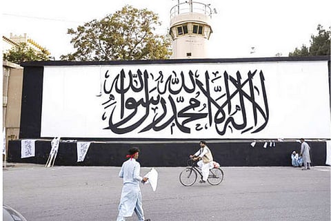 As world marks 9/11, Taliban flag raised over seat of power