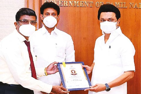 M Nickolas of St Mary?s Anglo Indians HSS receiving the State-level Best Teacher award from the CM