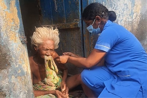 A 95-year-old woman being vaccinated at her home in Chennai's Royapuram