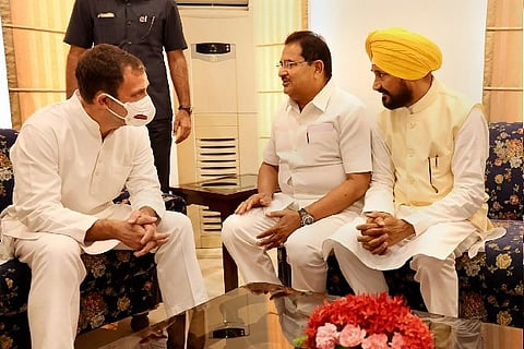 Rahul Gandhi (L) with Charanjit Singh Channi (R) and OP Soni (C) after taking oath, in Chandigarh