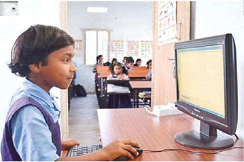 A student using a computer in a school. File photo