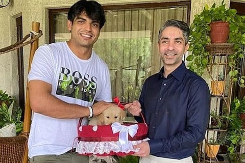 Abhinav Bindra gifts India's Olympic gold medallist Neeraj Chopra a puppy (Image source: IANS)