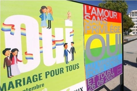 Posters are flaunted before election (Credit: Reuters)