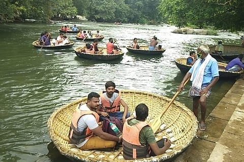 Tourists take coracle rides in Hogenakkal.