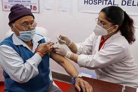 A health worker injecting a covid jab to a person (Image credit: PTI)