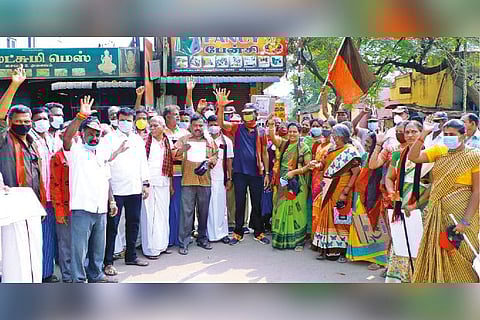DMK workers staging a protest in Coimbatore on Wednesday