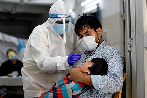 A health worker taking RT-PCR test (Image credit: PTI)