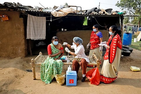A woman receives a dose of Covishield vaccine (Credit: Reuters)
