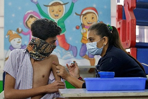 A boy receives a dose of Bharat Biotech's Covid vaccine (Credit: Reuters)