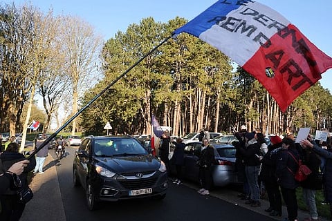 Protestors waving France flag