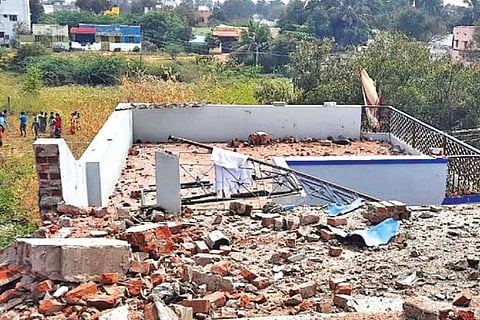 Debris strewn after crackers blast at a house in Nalliveeranpatti near Usilampatti in Madurai