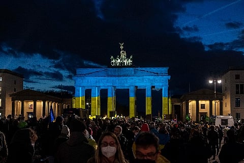 Berlin's Brandenburg gate in Ukrainian colours in solidarity with the country. Image - AP