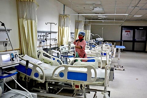 A staff member cleans medical equipment inside a ward (Credit: Reuters)