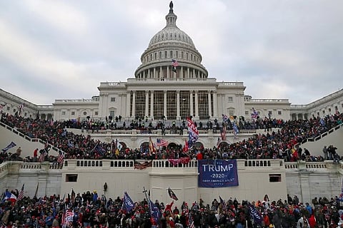 A mob of supporters of U.S. President Donald Trump storm the U.S. Capitol Building (Credit: Reuters)
